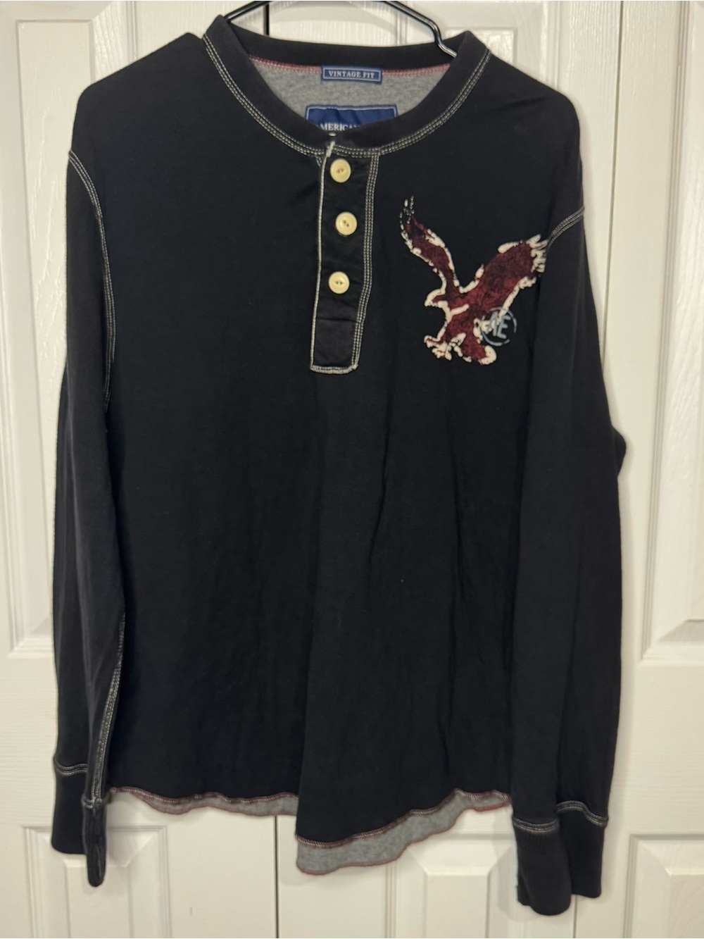American Eagle Outfitters Black Long-Sleeve Henley with Red Eagle Patch